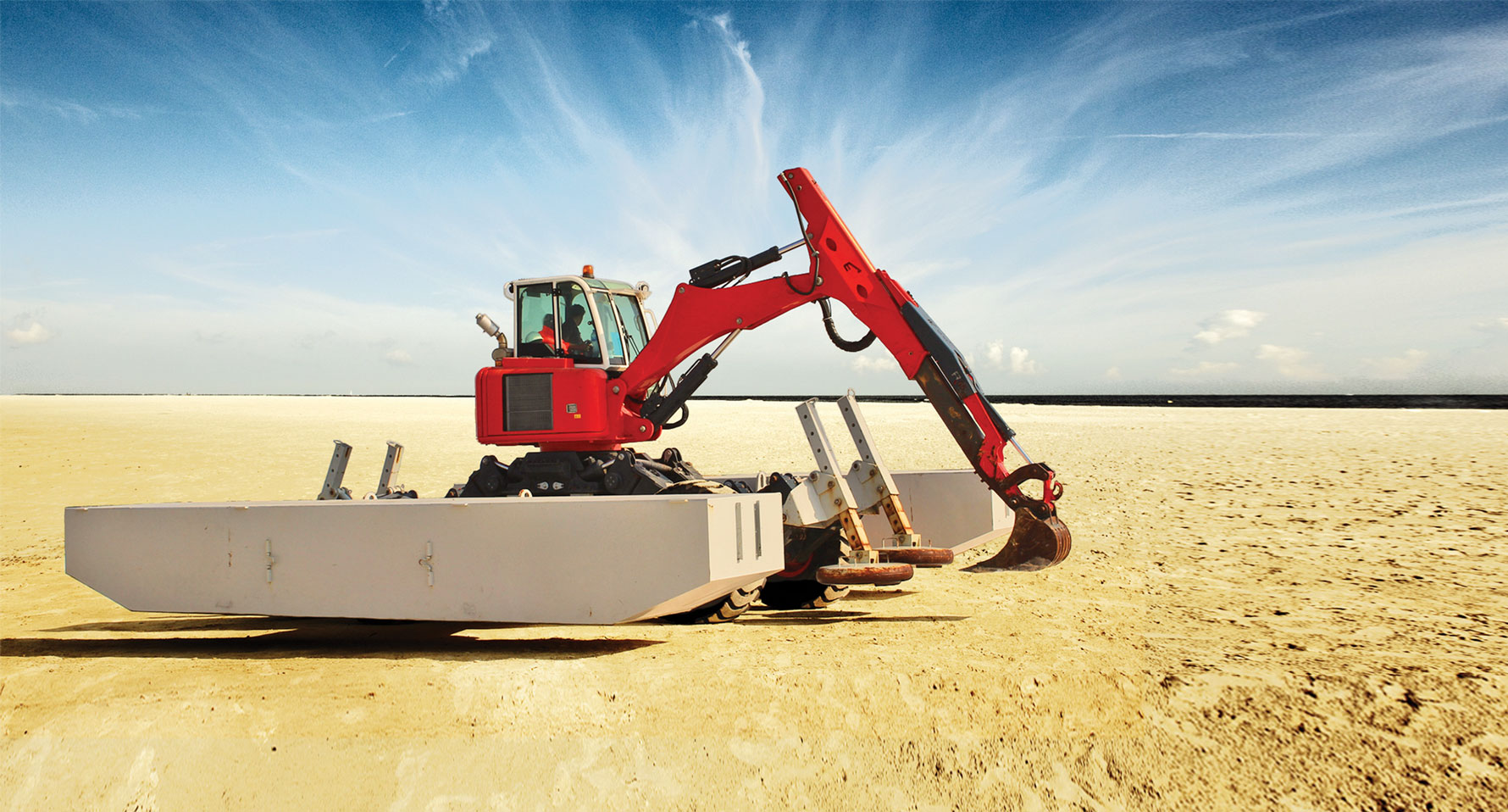 Thainex Aqua Spider on land Thainex Aqua Spider Amphibious excavator drivin on land with wheels and attached pontoons.